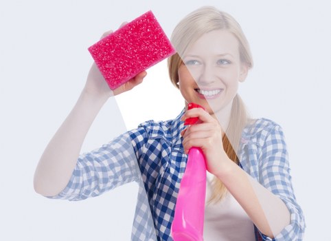 Marylebone cleaner using protective gloves and mask during a cleaning task